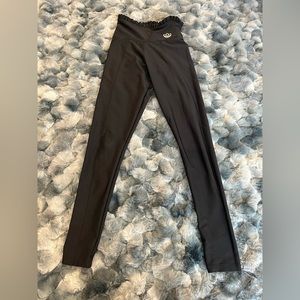 High waisted, shiny finish Adidas leggings with ruffled waist.